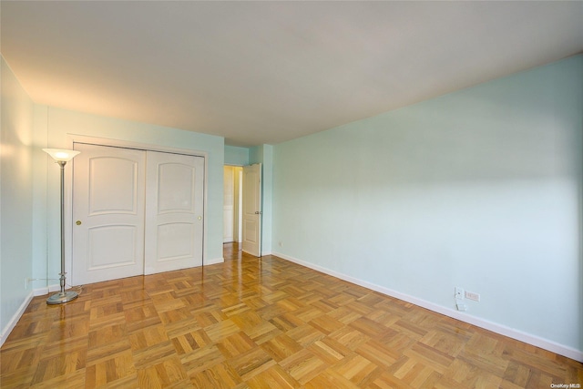 unfurnished bedroom with light parquet floors