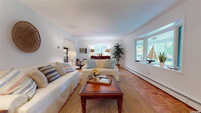 living room featuring light parquet flooring and a baseboard heating unit