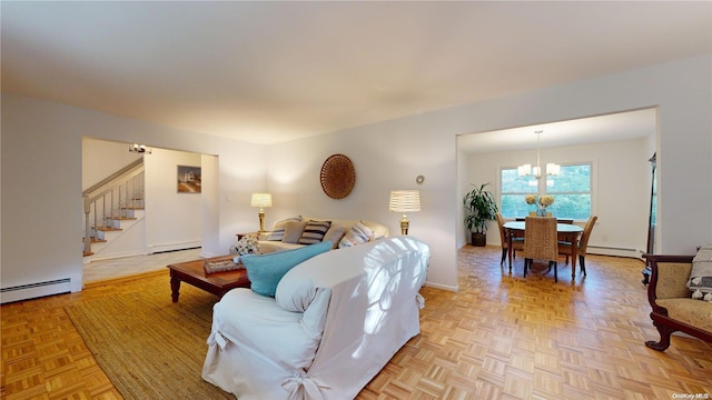 living room with light parquet flooring, an inviting chandelier, and a baseboard heating unit