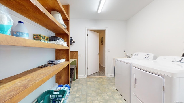 clothes washing area with washer and dryer