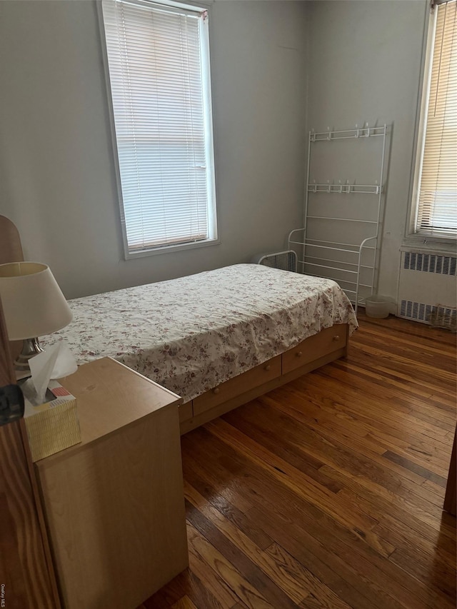71-11 Yellowstone Blvd Unit 2D, Forest Hills, NY 11375 - bedroom with dark wood-type flooring and radiator heating unit