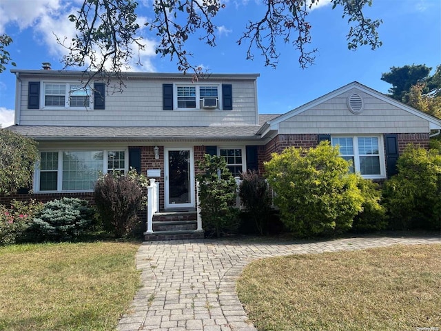 view of front of home featuring a front lawn