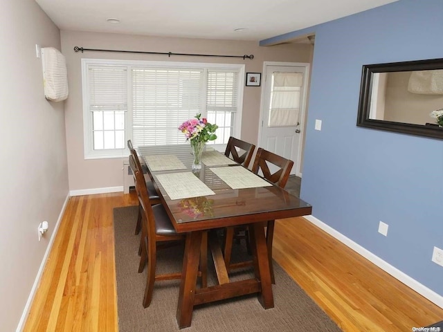 dining area with light hardwood / wood-style flooring