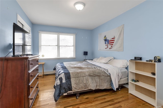 bedroom with light hardwood / wood-style flooring