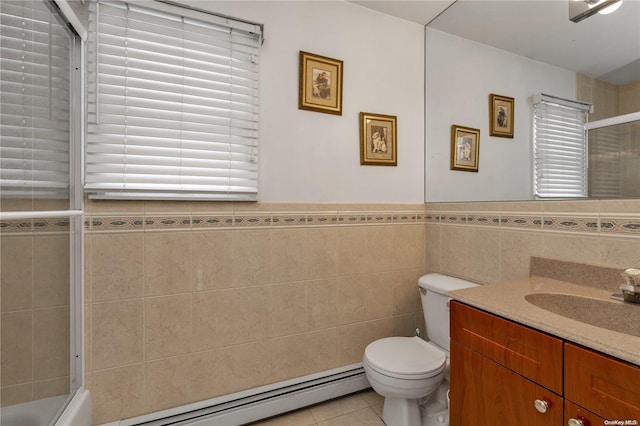 full bathroom with tile patterned floors, vanity, shower / bath combination with glass door, tile walls, and toilet