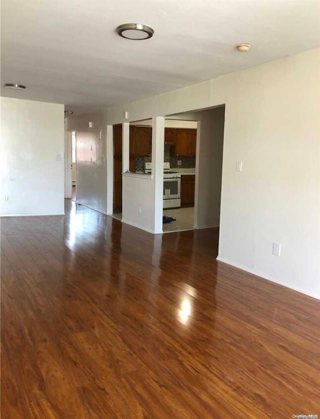 unfurnished room featuring dark hardwood / wood-style floors