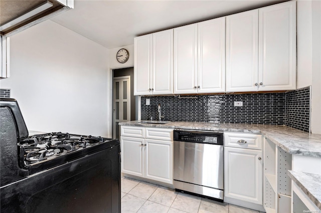 kitchen featuring white cabinets, light stone counters, sink, dishwasher, and black gas stove