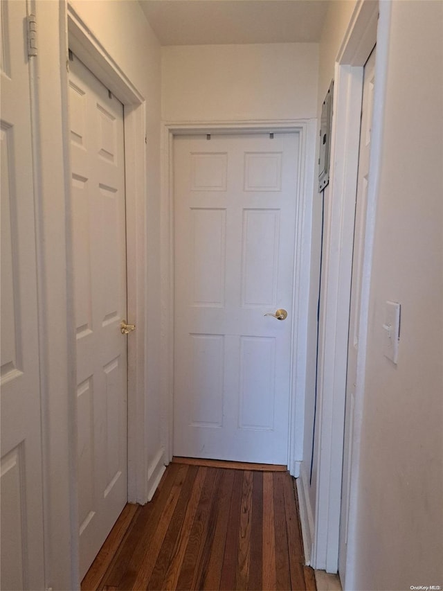 hall with dark hardwood / wood-style flooring