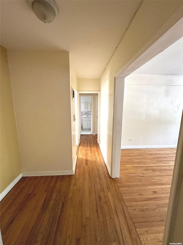 corridor featuring hardwood / wood-style flooring