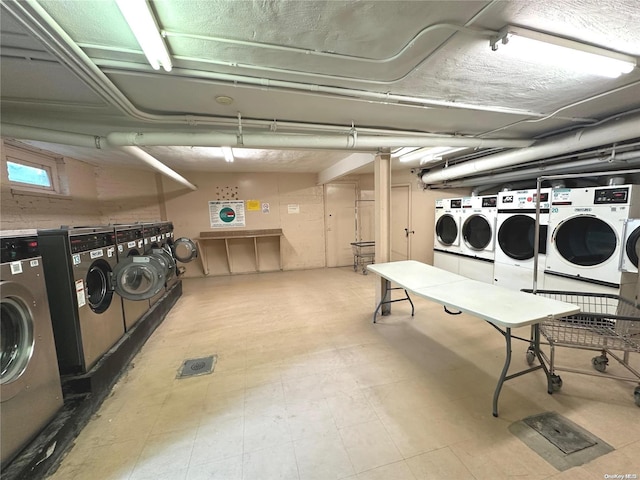 washroom with washing machine and dryer