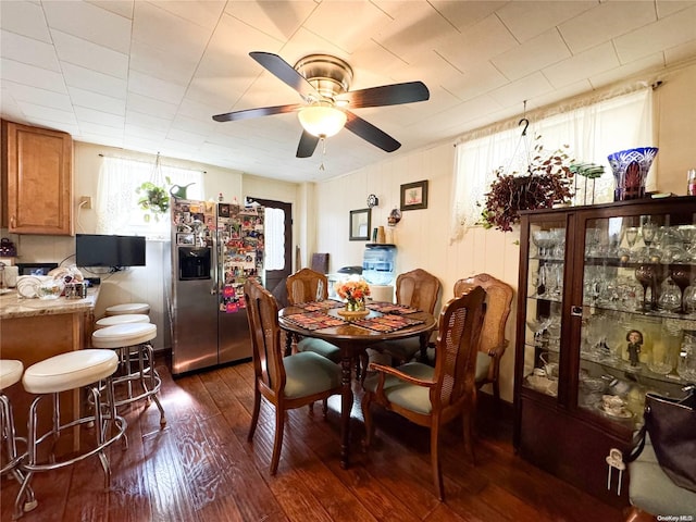 dining room with dark hardwood / wood-style floors and ceiling fan