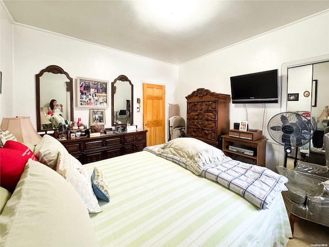 bedroom with ornamental molding