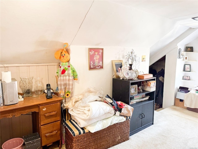 bedroom featuring carpet and vaulted ceiling