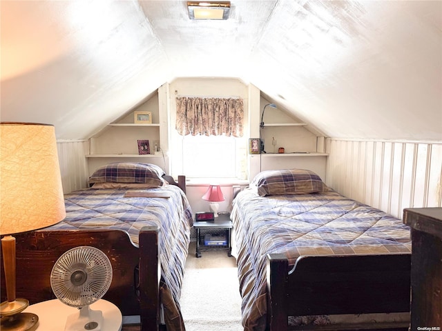 carpeted bedroom featuring vaulted ceiling