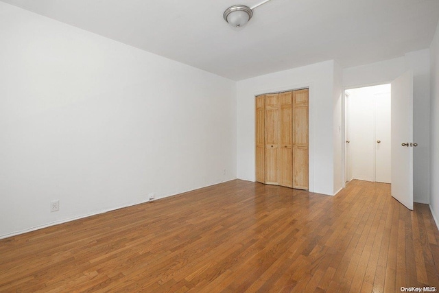 35-51 85th St Unit 3-L, Jackson Heights, NY 11372 - unfurnished bedroom with a closet and hardwood / wood-style floors