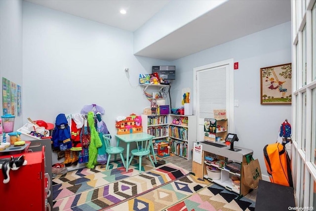 recreation room with light hardwood / wood-style floors