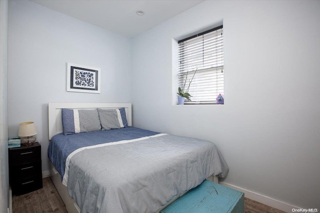 bedroom featuring dark wood-type flooring