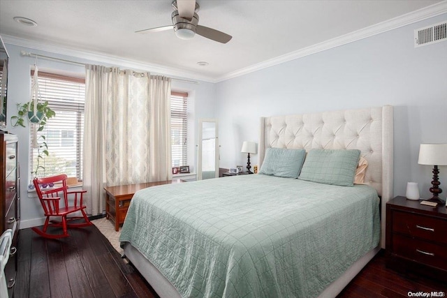 bedroom with ceiling fan, dark wood-type flooring, and ornamental molding