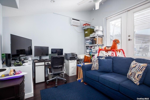 office area featuring a wall mounted air conditioner, dark wood-type flooring, and lofted ceiling