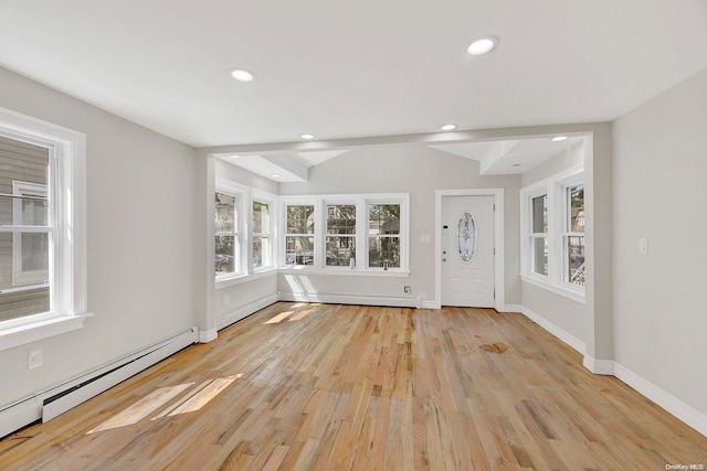 interior space featuring light wood-type flooring and a baseboard radiator