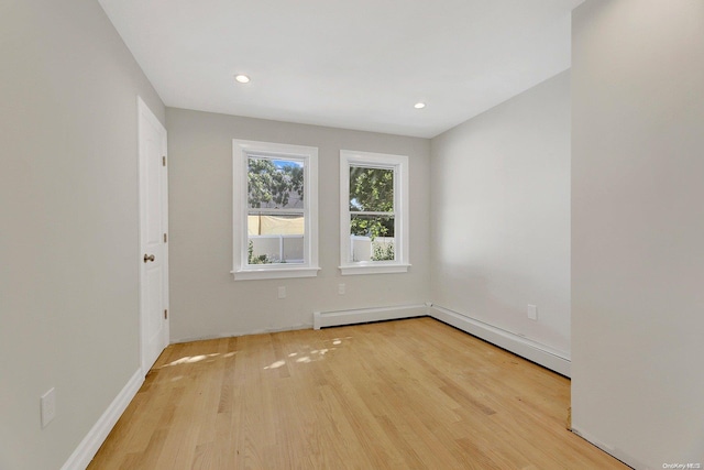 empty room with light hardwood / wood-style floors