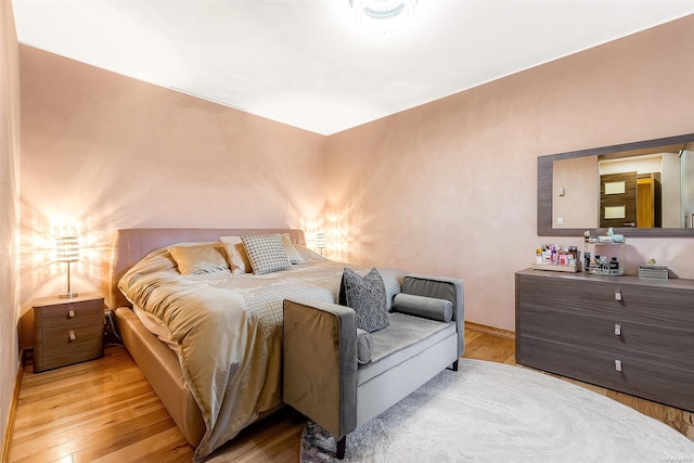 bedroom with light hardwood / wood-style flooring