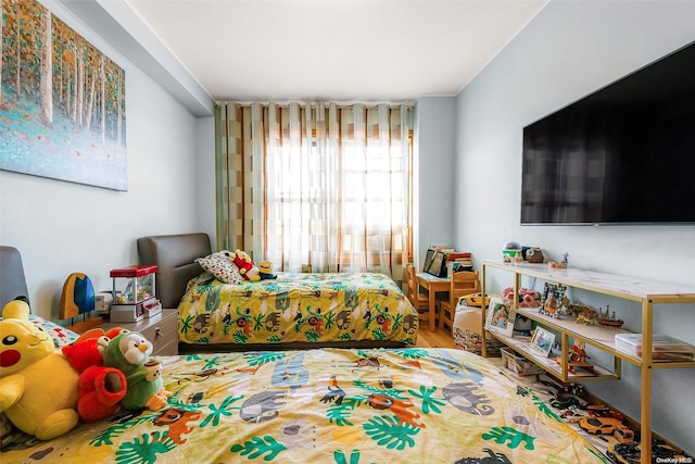 bedroom with wood-type flooring