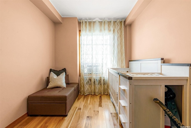 sitting room with light hardwood / wood-style flooring