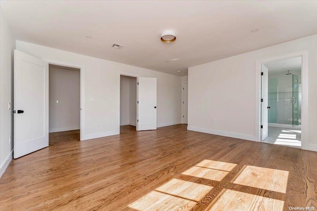 unfurnished room featuring light hardwood / wood-style flooring