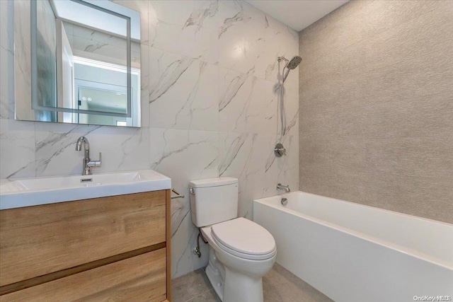 full bathroom featuring shower / washtub combination, vanity, tile walls, and toilet