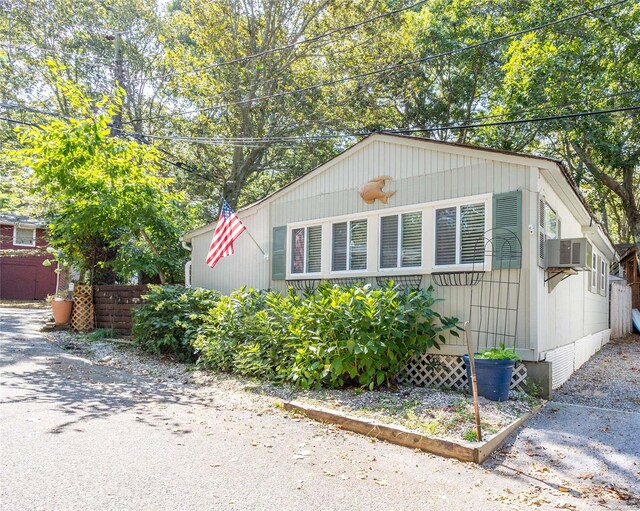 42 Cottage Rd, Baiting Hollow, NY 11933 - view of front of home with cooling unit