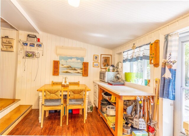 42 Cottage Rd, Baiting Hollow, NY 11933 - dining space featuring vaulted ceiling and wood finished floors