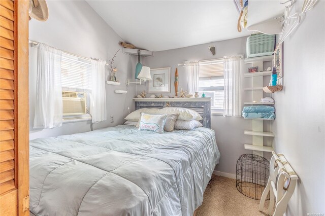 bedroom with carpet flooring, cooling unit, and radiator