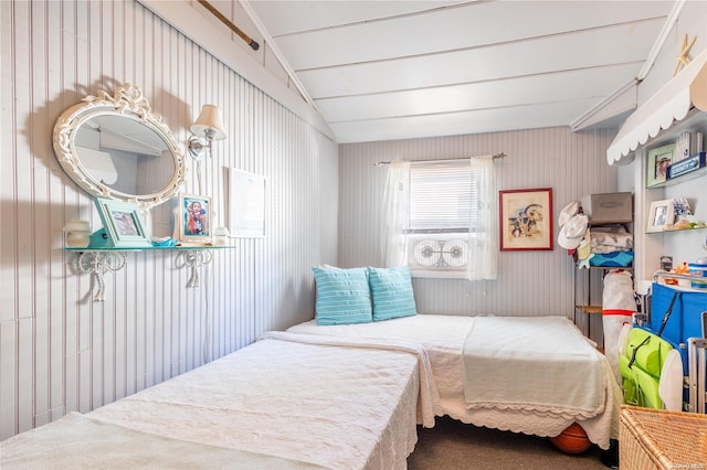 bedroom featuring carpet flooring and vaulted ceiling