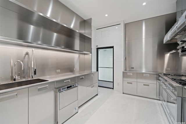 kitchen with high end stainless steel range oven, white fridge, sink, and range hood