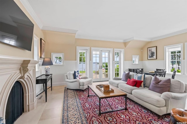 living room featuring french doors, crown molding, and light tile patterned flooring