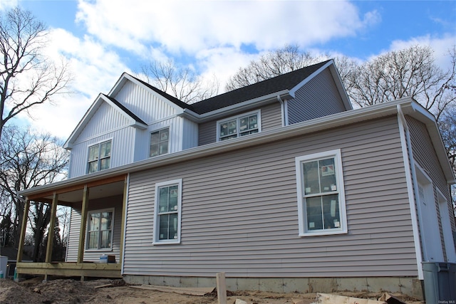 view of property exterior with covered porch