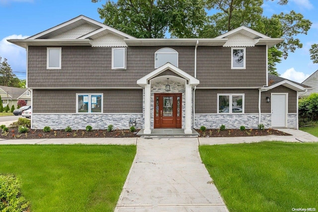 view of front of property with a front lawn