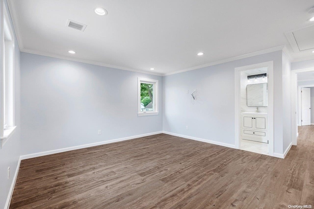 unfurnished room featuring wood-type flooring and ornamental molding