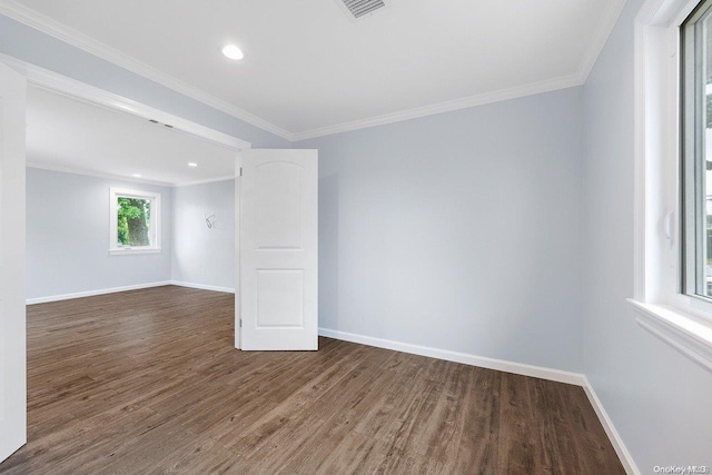 spare room with dark hardwood / wood-style floors and ornamental molding