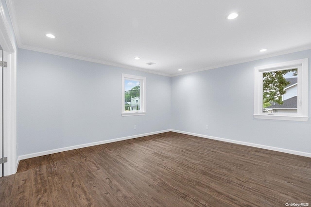 unfurnished room with dark hardwood / wood-style flooring and crown molding