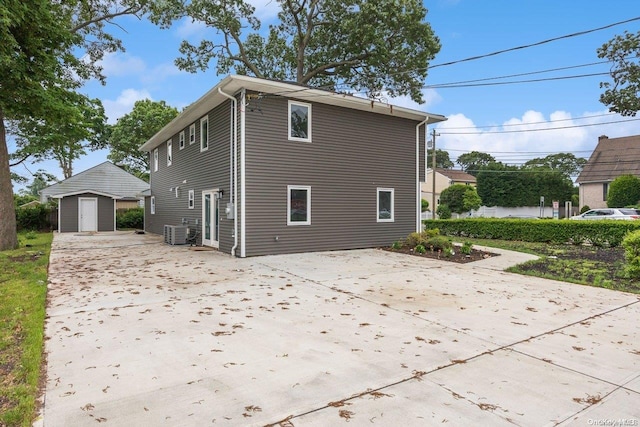 view of property exterior featuring a shed and central air condition unit