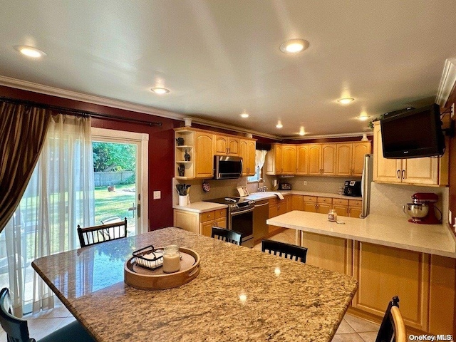 kitchen with light stone counters, crown molding, a kitchen bar, light tile patterned floors, and appliances with stainless steel finishes