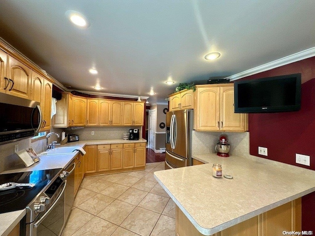 kitchen with light tile patterned flooring, stainless steel appliances, ornamental molding, and sink