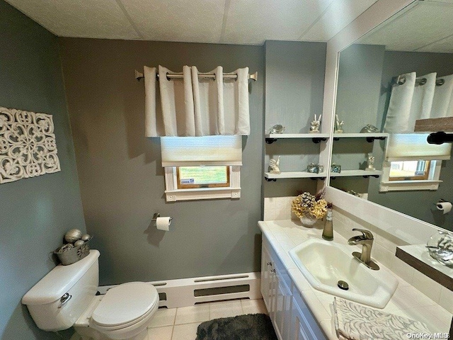 bathroom featuring tile patterned floors, vanity, and toilet