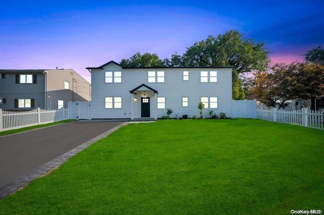 view of front of property with a lawn