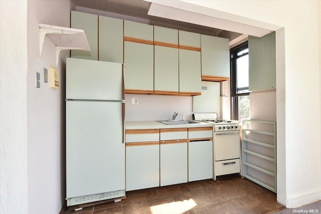 kitchen with white appliances and sink