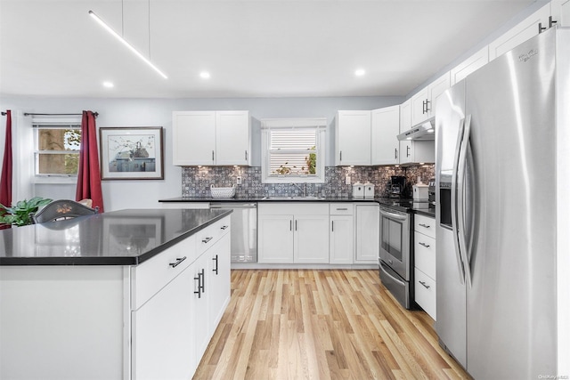 kitchen featuring light hardwood / wood-style floors, white cabinetry, and stainless steel appliances