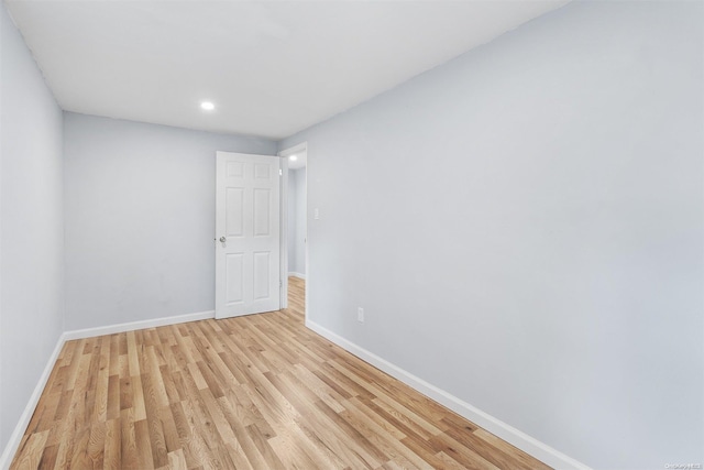 spare room featuring light hardwood / wood-style flooring