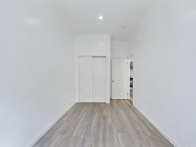 unfurnished room with light hardwood / wood-style flooring